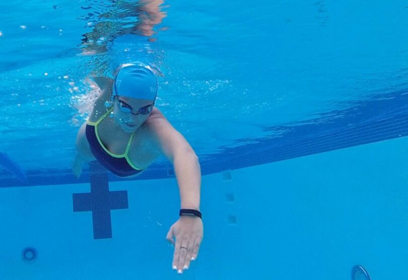 swimmer with Waterfi Fitbit Alta