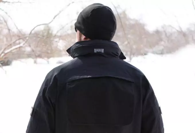 man wearing tactical jacket in snowy weather