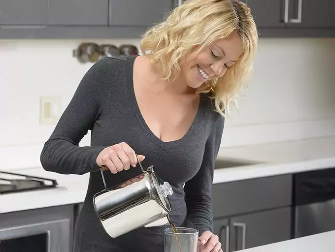 woman pouring hot coffee