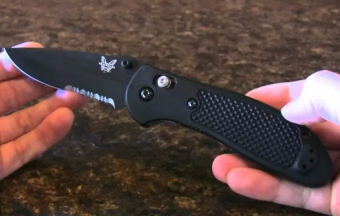holding a benchmade knife