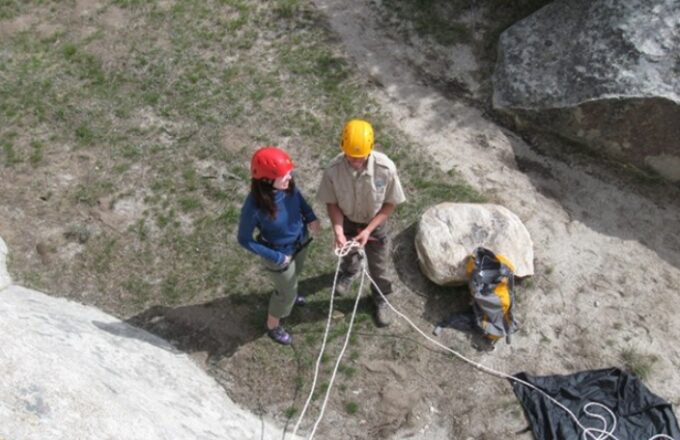 teacher explaining rock climbing