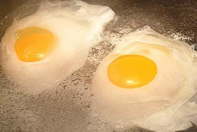 two eggs poaching